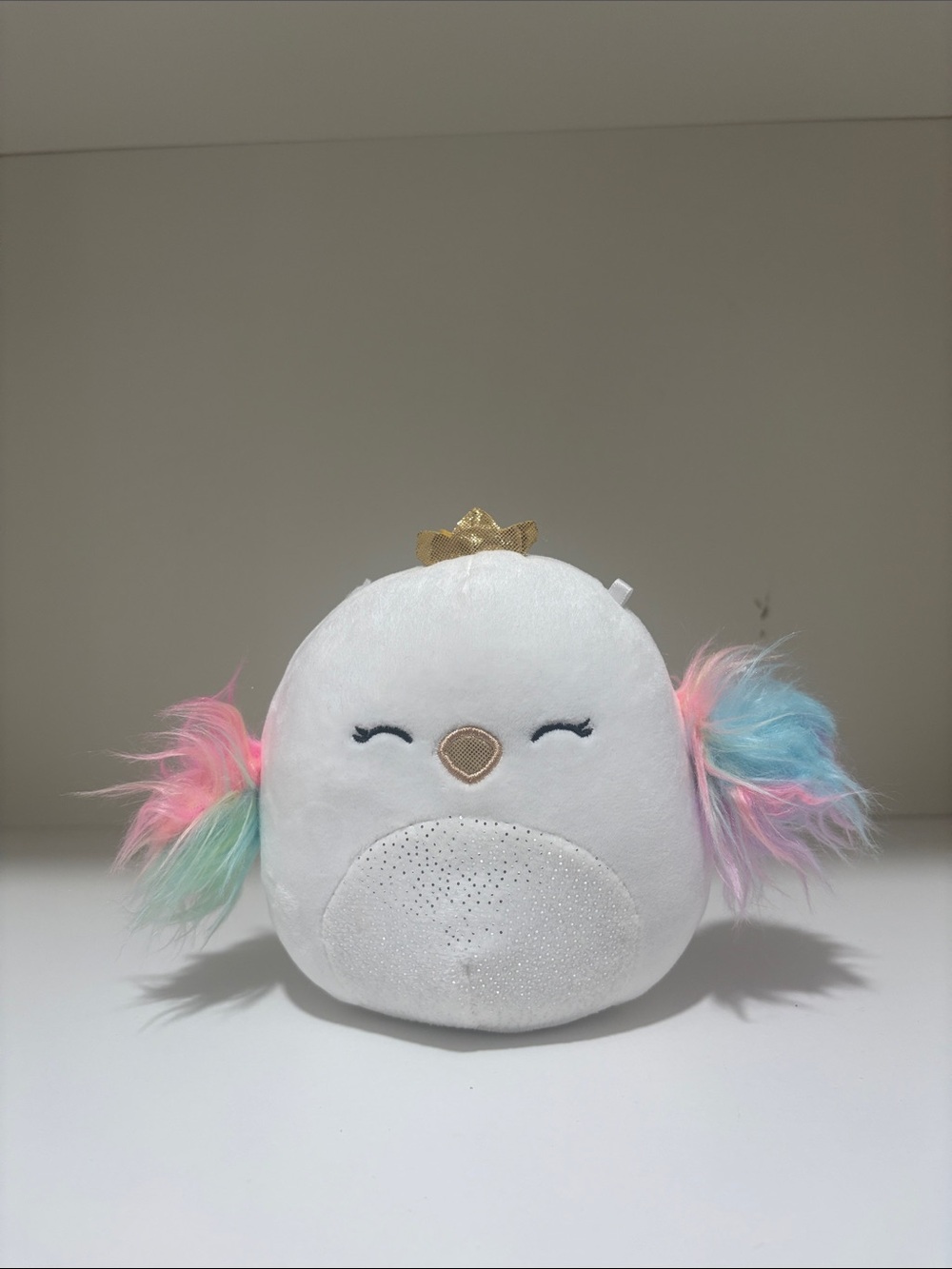 Plush White Bird Pillow with Pastel Rainbow Ears and Gold Crown